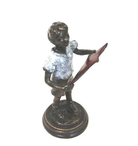 boy sculpture by JOEL shown with a red kite